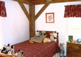Bedroom with Exposed Wood Beams