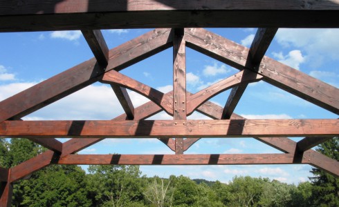 King post trusses with curved webs.
