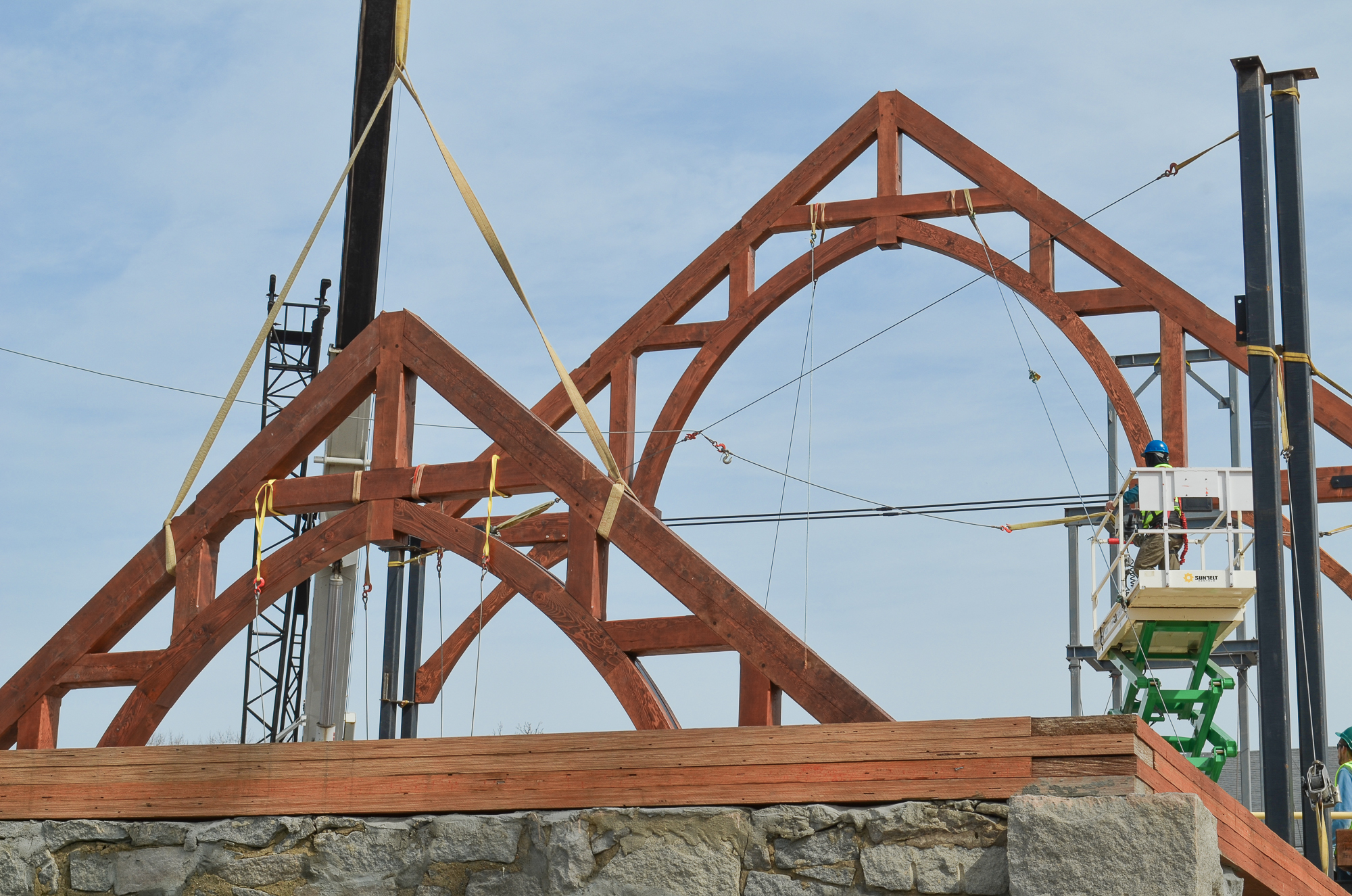 Arched Trusses being raised while constructing the timber frame for The Church of St. Michael the Archangel