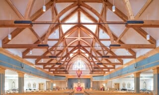 Interior of the Immaculate Conception church with arches with steel tie rods.