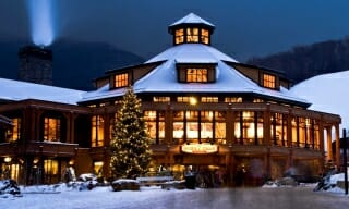 Octagon Timber Frame Ski Lodge at Night