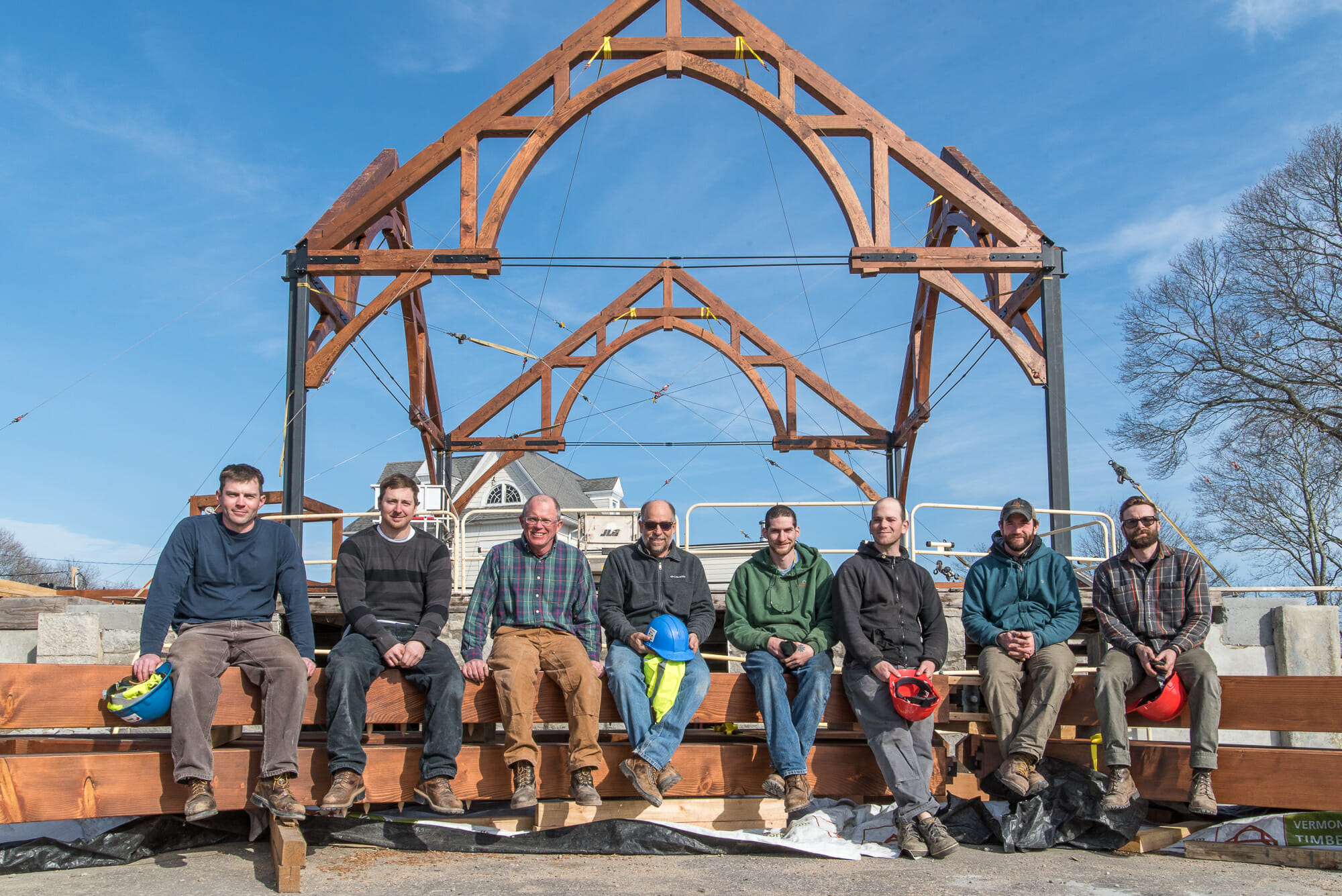The crew relaxing after installing the first trusses for Saint Michael the Arch Angel Church in Pawcatuck Connecticut