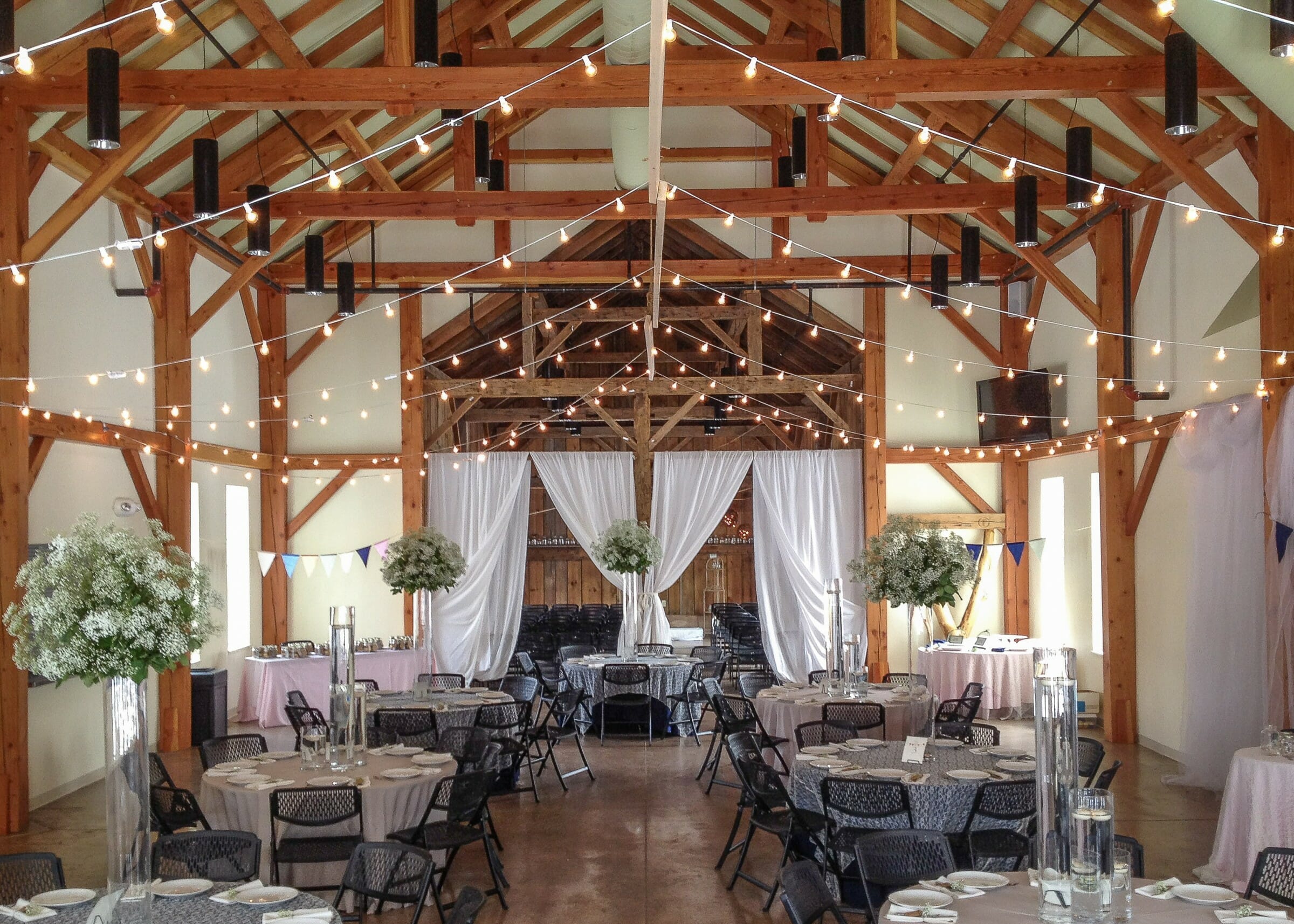 Wedding post and beam barn decorated