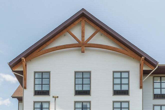 King Post Truss with arch on the gable of a hotel building