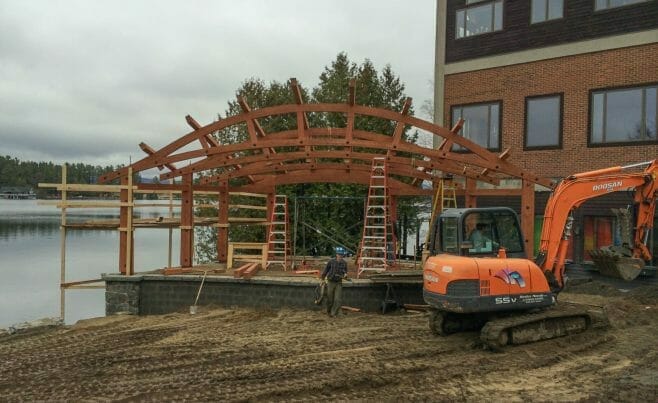 Timber frame company raising a band shell