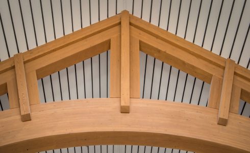 The Mahamudra Buddhist Retreat in Cragsmoor, NY has a heavy timber entry way and interior trusses fabricated from Glulam and Douglas Fir