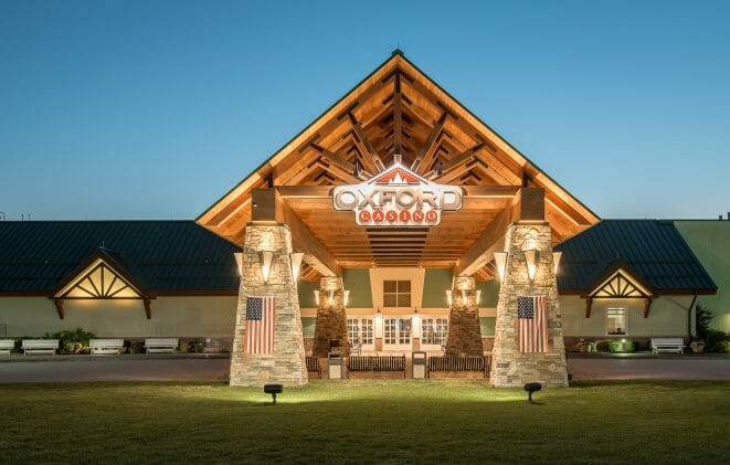 Heavy Timber Porte Cochere Entry Way at the Oxford Casino in Maine with King post trusses in White Pine with steel plates.