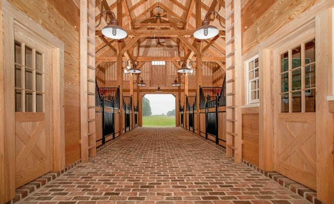 Timber Frame Horse Barn entrance with tack rooms, aisle and storage space