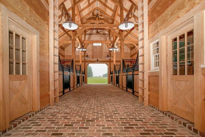 Timber Frame Horse Barn entrance with tack rooms, aisle and storage space