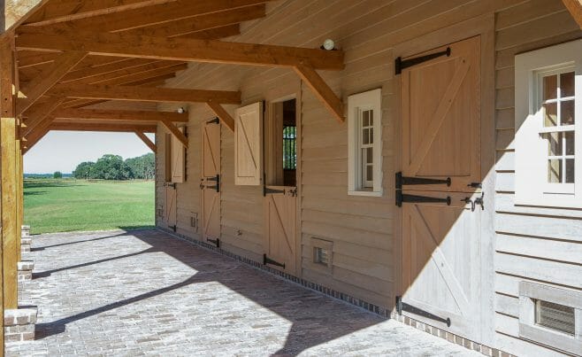 Timber framed barn with loafing shed