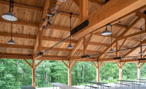 40'x68' Heavy timber pavilion - inside view showing queen post trusses and steel tie rods.