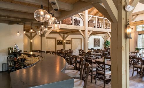 Interior of the Briar Barn Inn in Rowley, MA. The Monitor style barn features rough sawn Hemlock posts, beams, and trusses.