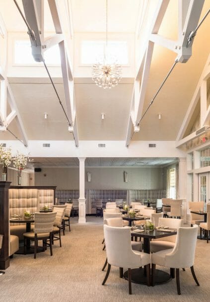 Modern, White heavy timber trusses with steel plates and tie bars in the Anya Restaurant in Thompson, CT.