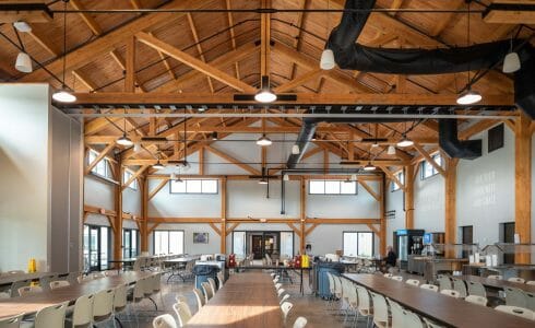 Heavy Timber Framed Dining Hall with Seating below the Trusses