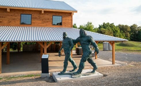 The bronze statue in front of the Jack Link Timber Frame Pavilion