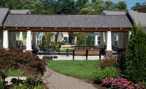 Heavy Timber Walkway with King Post Trusses in Doug fir, planed and chamfered with post bases with stone in Voorhees, NJ