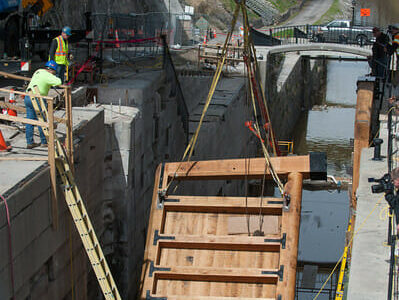 Lock gate being installed with a crane