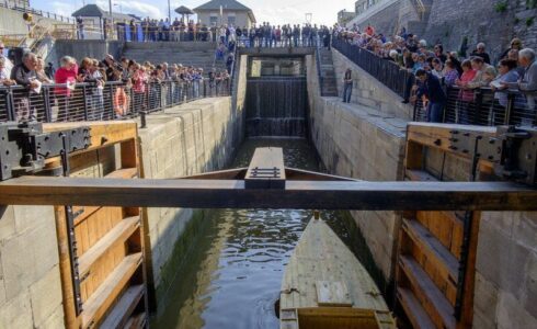 Opened Miter Lock Gate with a boat in the canal
