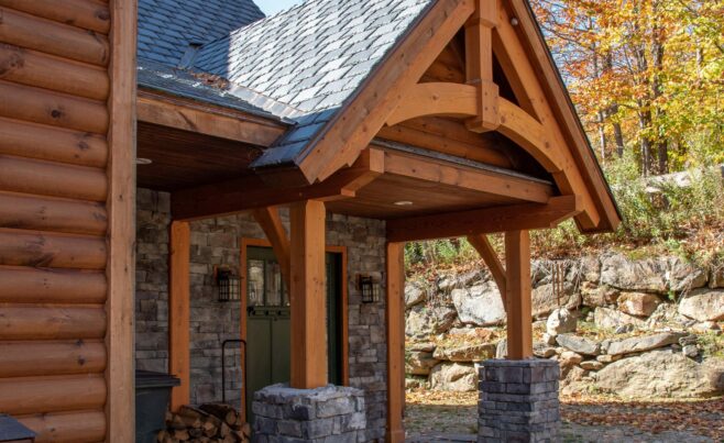 Decorative Entryway with Wood Trusses on the Exterior of a Ski House