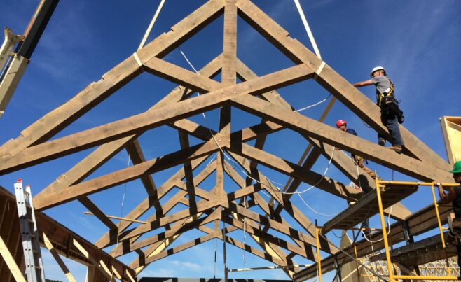 Scissor trusses being erected