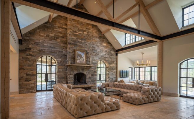Timber Frame Living Room With a Stone Fireplace