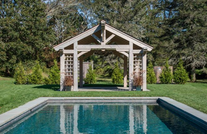 Embellished timbers in a pavilion by a swimming pool in Connecticut.