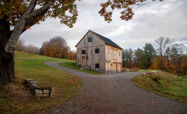Exterior of a rough sawn post and beam barn.
