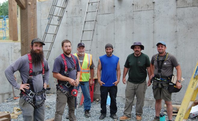The assembly crew at Vermont Timber Works after a raising.