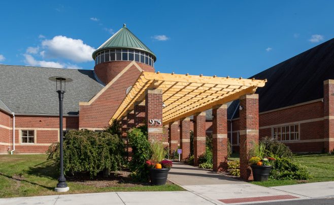 Cedar timber pergola with scrolled rafter tails