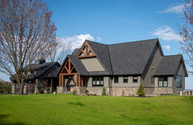 Home with a Timber Frame Entryway and timber gable trusses in upstate New York