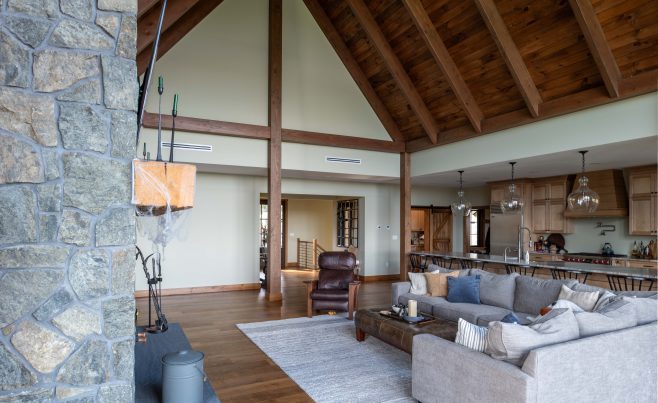 Living room and kitchen with timber and stone.