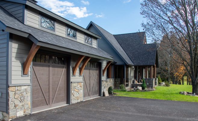 Wood brackets by garage doors