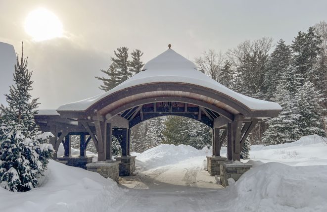 Timber framed porte cochere for a Vermont ski house.