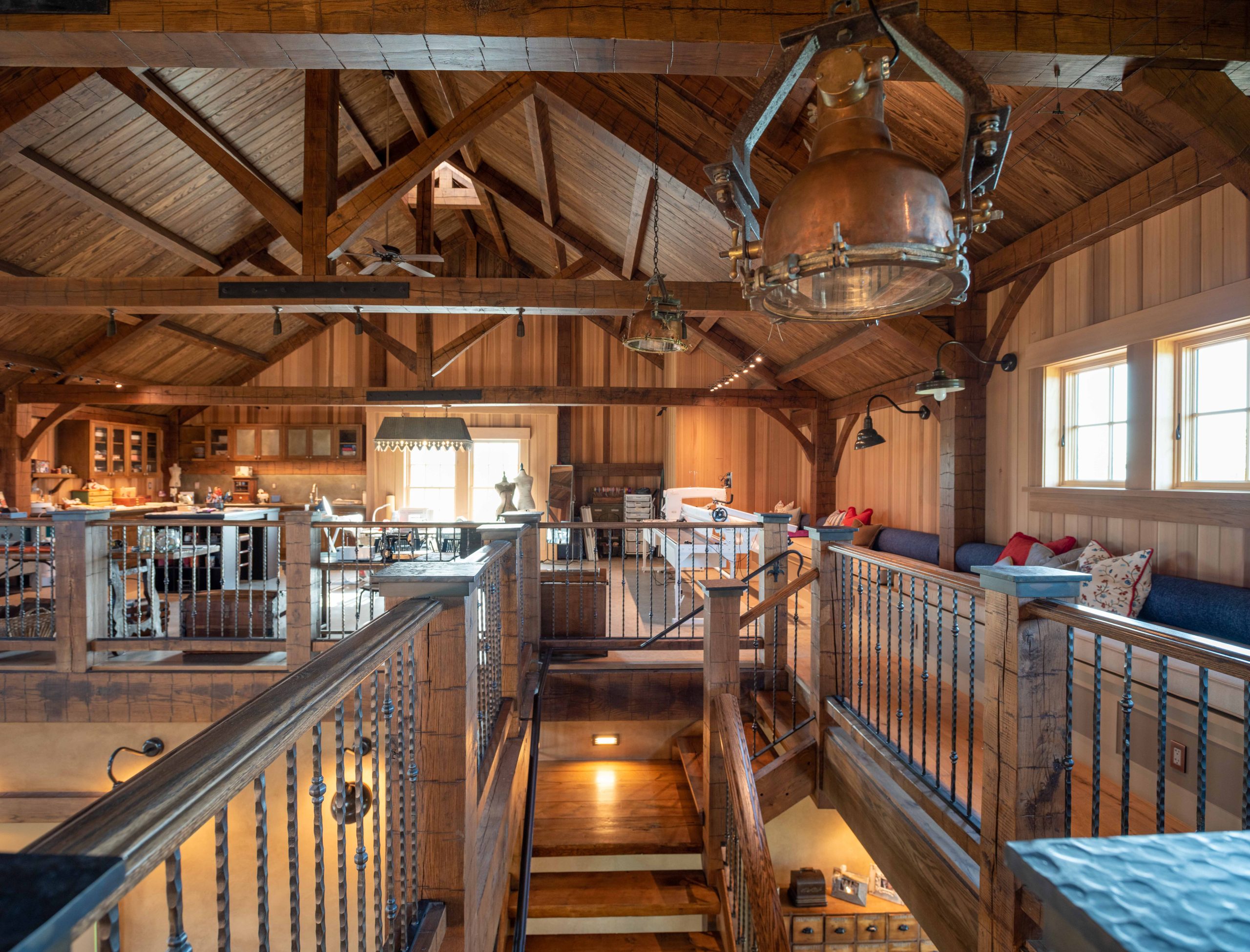 Timber framed barn upstairs featuring king post trusses