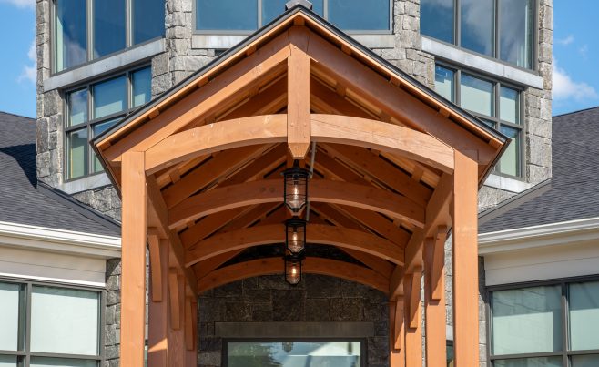 Arched timber truss over entry showing the lanterns