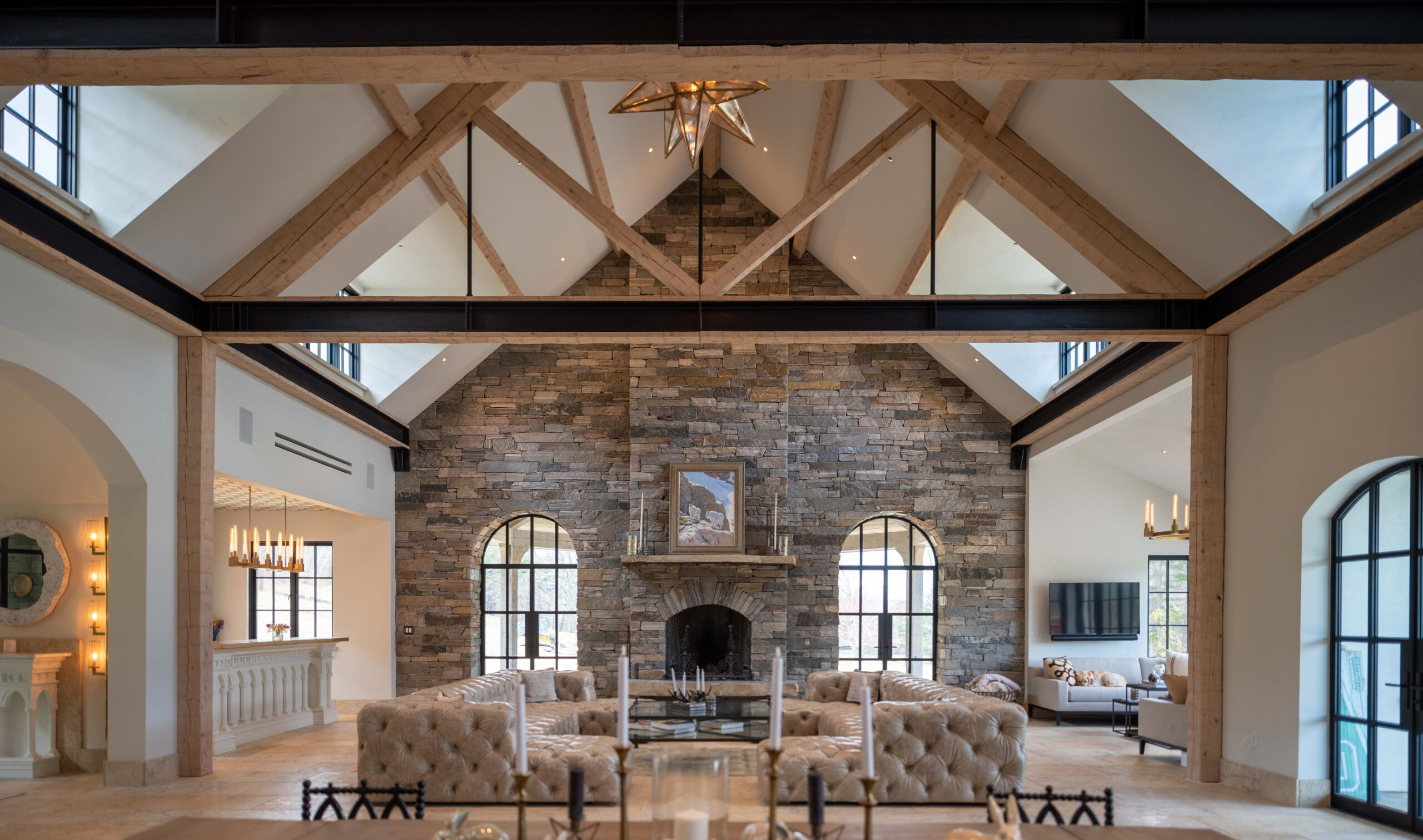 Meyers Residence NH Cathedral Ceilings living room with timber trusses and steel beams