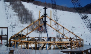 Heavy Timber girder roof trusses forming an 80' octagon timber frame.